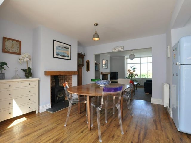 The dining area with feature fireplace and stove.