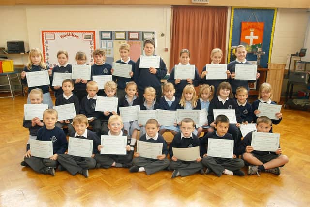 St Mary's School pupils celebrate a 100% attendance award. PA0321-8a