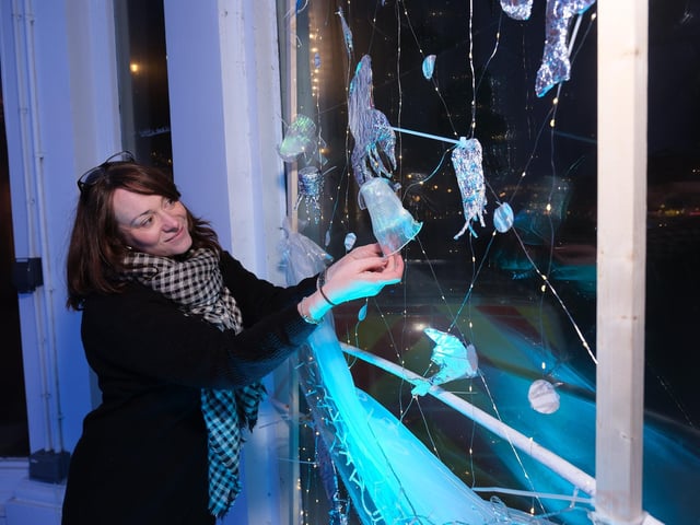 Zoe Lee Gadd views the window designs