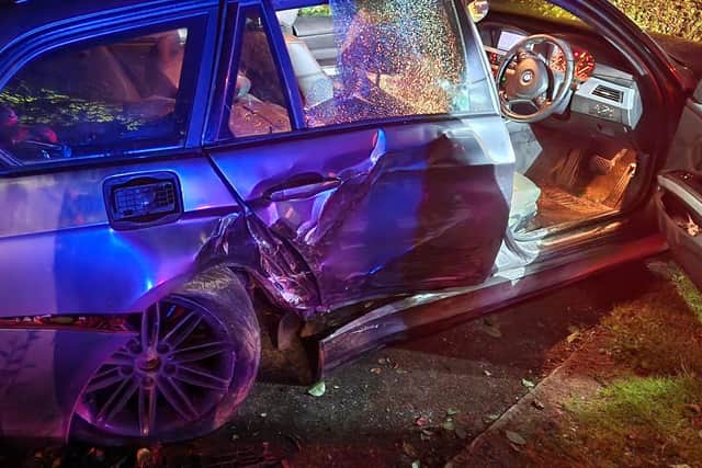Damaged vehicle at the scene of the collision