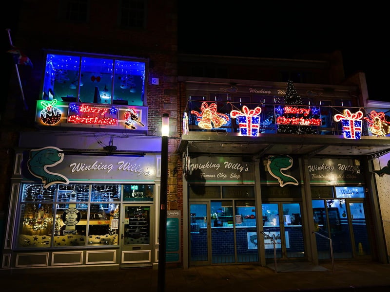 Winking Willy's lighting up the night.