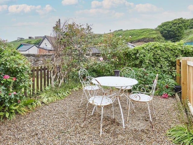 The rear of the property has a charming garden with rural views. The perfect place relax when the weather permits.