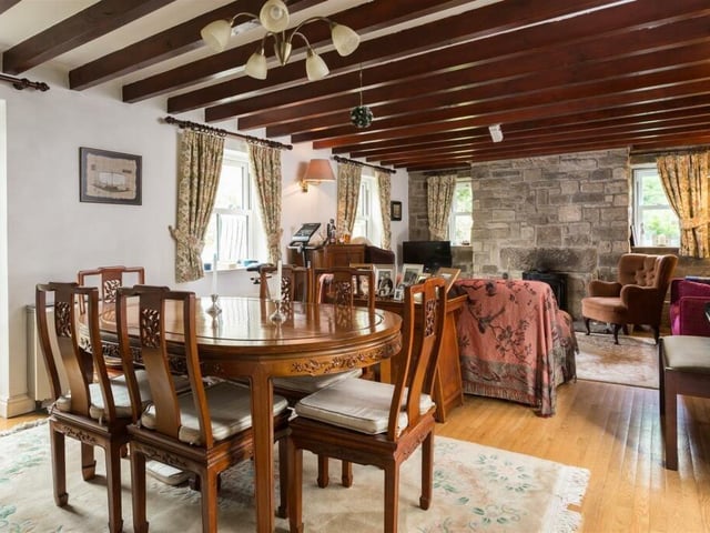 Spacious beamed living areas, with exposed stone and plenty of natural light.