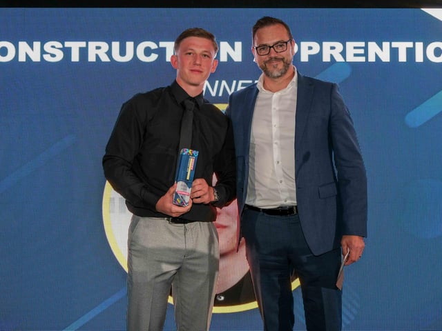 Construction Apprentice of the Year Award winner Jack Jefferson, of JC Services & Sons, presented with his award by Ian Anfield, managing director of sponsors Hudson Contract
