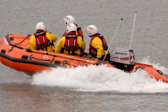 FIley RNLI rescue a family of three from cut off tide.