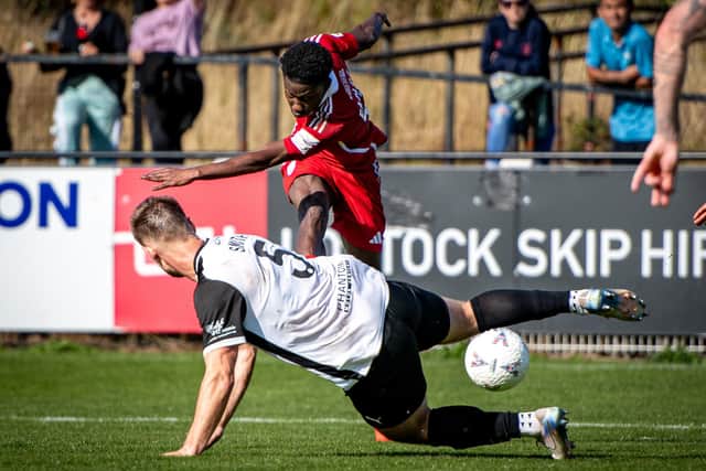 Mo Fadera's effort is blocked by Harvey Smith. Photo by Ben Gordon