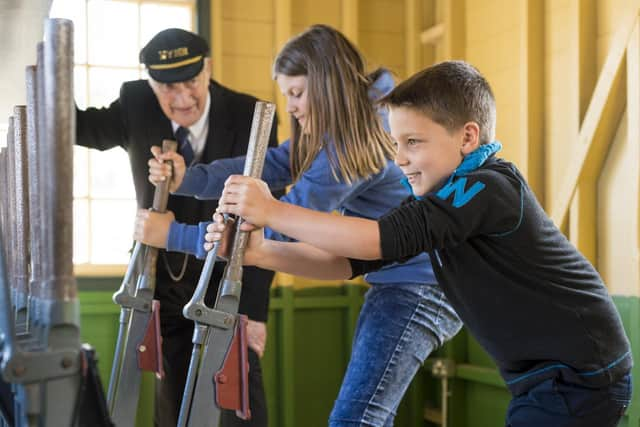 Youngsters visit a signal box.