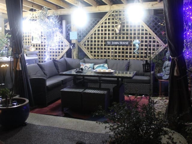 A pergola with seating area.