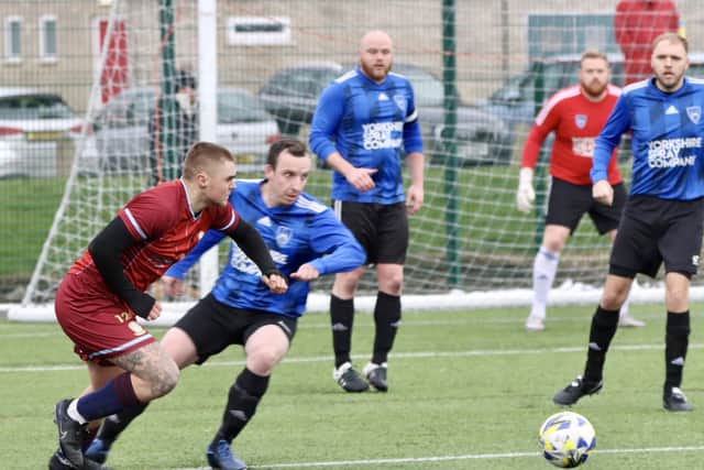 The race is on to reach the ball in the league encounter.