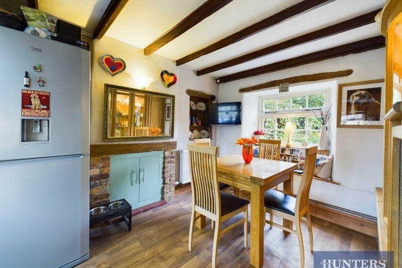 The dining room has a window seat, and several other original features of interest.