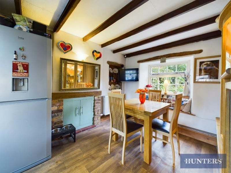 The dining room has a window seat, and several other original features of interest.