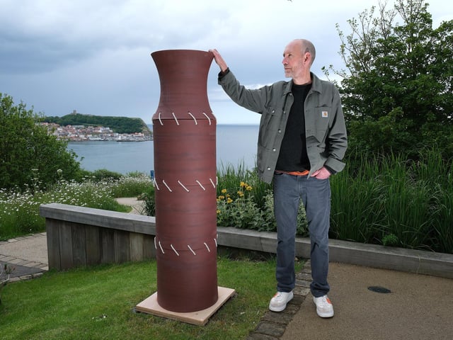 Matt Machouki with one of his sculptures.