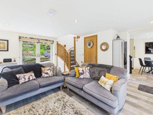 An open plan arrangement to the ground floor, with doors leading out to the garden.
