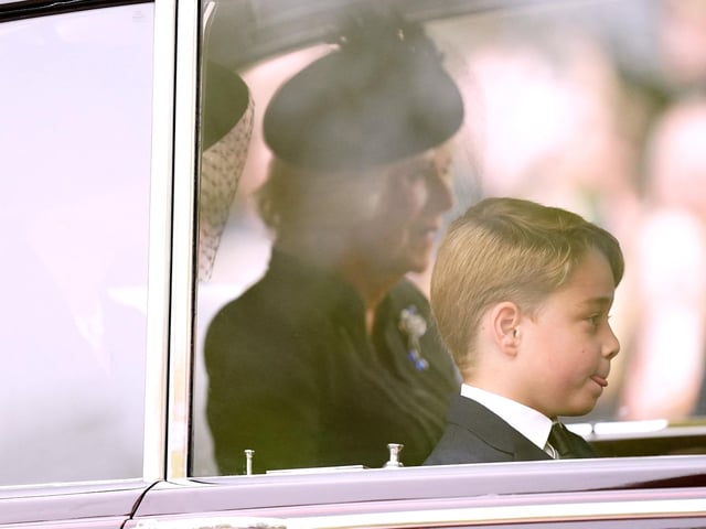 Camilla, Queen Consort and Prince George are seen on The Mall ahead of the State Funeral of Queen Elizabeth II at Westminster Abbey. (Photo by Mike Egerton / POOL / AFP) (Photo by MIKE EGERTON/POOL/AFP via Getty Images)