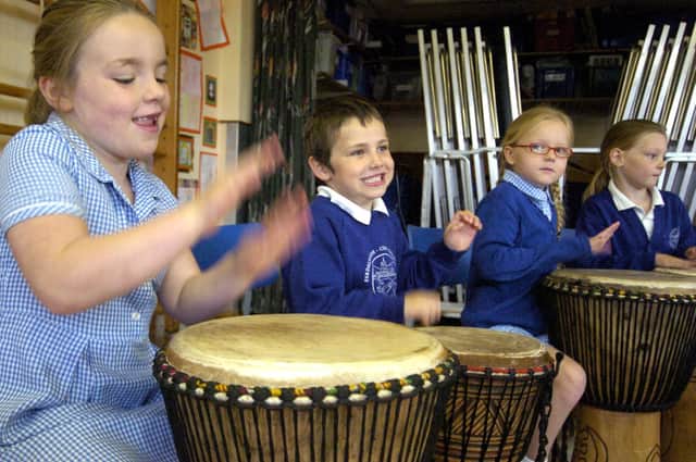Children from Sleights School playing African drums for Zimbabwean day.
w092507a