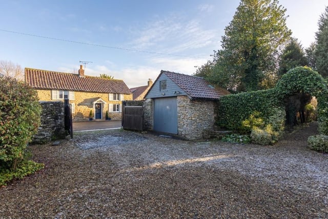 The house has plenty of potential for development, with a detached studio and workshop.