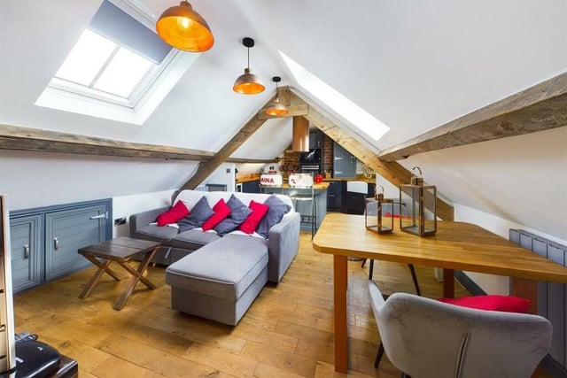 Quirky open plan living space, with beamed ceiling and velux windows.