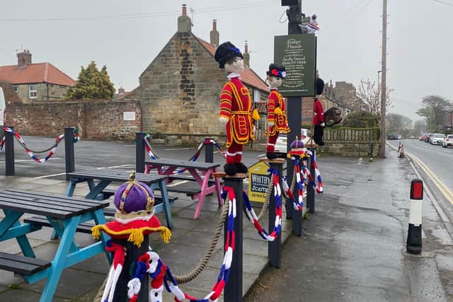 Hand-knitted Beefeaters 'guarding' the Badger Hounds, Hinderwell, for the King's Coronation.