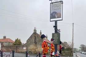 Hand-knitted Beefeaters 'guarding' the Badger Hounds, Hinderwell, for the King's Coronation.