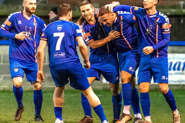 Blues players congratulate match-winner Shaun Tuton