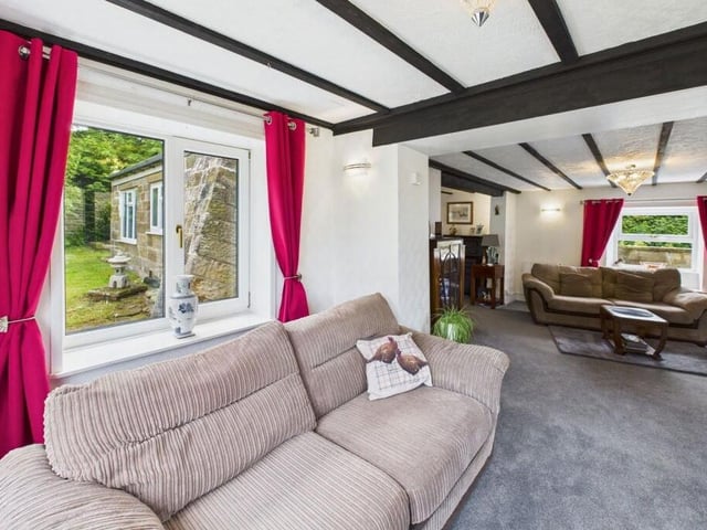 The lounge leads to a snug with all-round garden views.