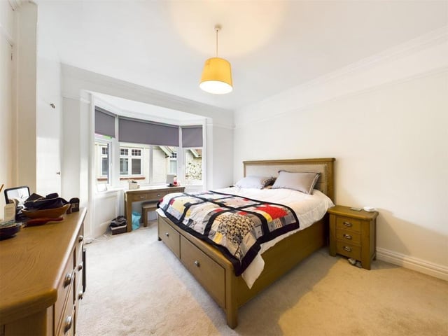 A double bedroom with bay window.