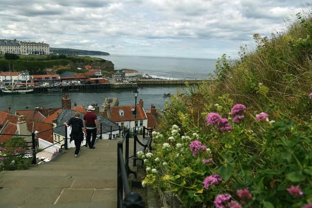 People walk down the 199 steps from Whitby Abbey. (Pic credit: Jonathan Gawthorpe)