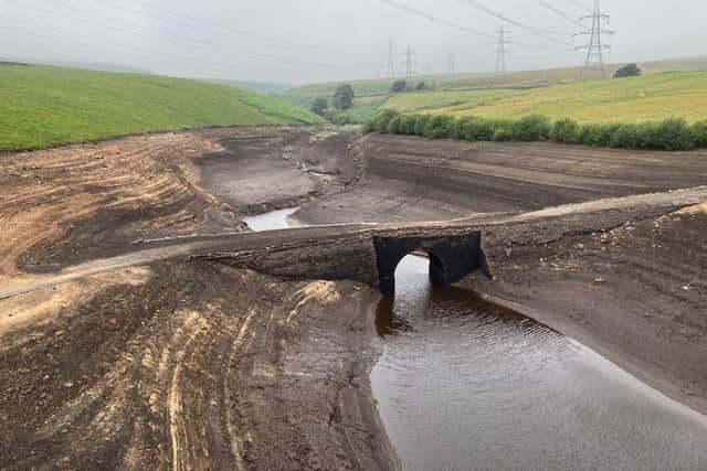 Low water levels at Baitings Reservoir have exposed an ancient packhorse bridge which has been submerged since the 1950s. (Photo: Yorkshire Water)