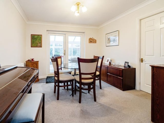 The dining area with doors through to the conservatory.