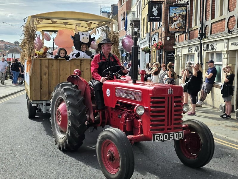 People taking shots of the parade vehicles. photo: Rhys Angus.