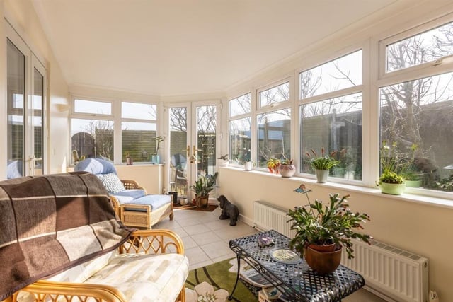 A year-round garden room provides versatile space.
