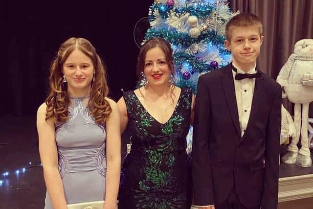 White Lily Ball organiser Lucy Mothersdale with her two eldest children, Ruby and Toby Bowes.