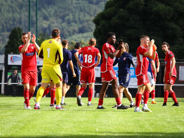 The Boro players and staff applaud the supporters after the final whistle.