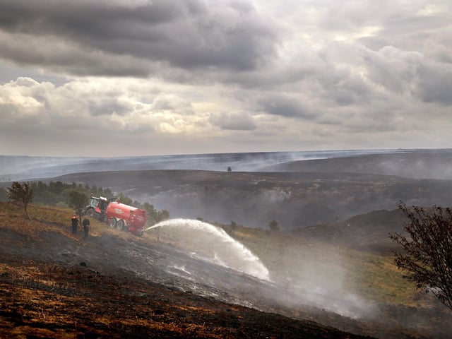 The Whitby Mooorland Fires, working hard to quell the blaze.