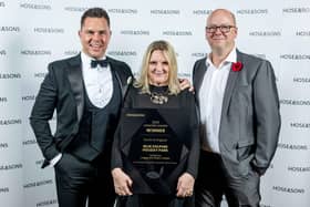 Ruth Kemplen (C) and Vaughn Medhurst (R), Owners of Blue Dolphin Holiday Park receive their award from Luke Hansford, Senior Vice President - Supply at Hoseasons (L).