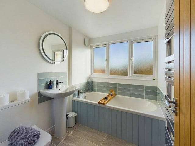 The first floor bathroom is light and airy.