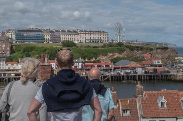 People looking at the Whitby wheel from across town. picture: Deborah McCarthy