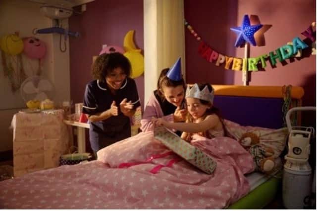 A young girl celebrates her birthday in a hospice.