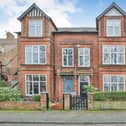 A front view of the attractive gated property.