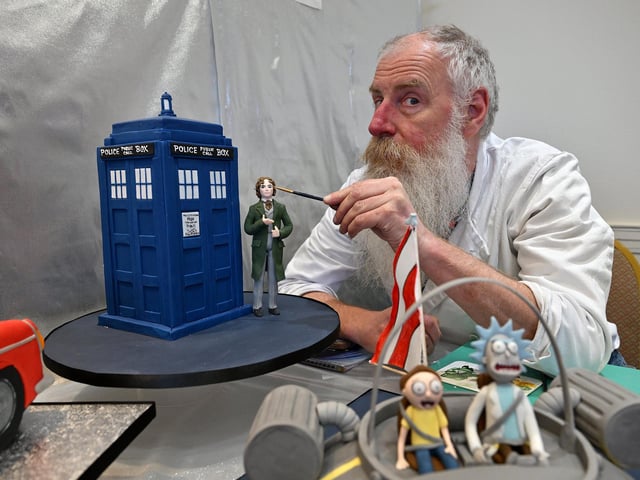 Anthony decorates Dr Who after finishing an incredible Tardis cake.