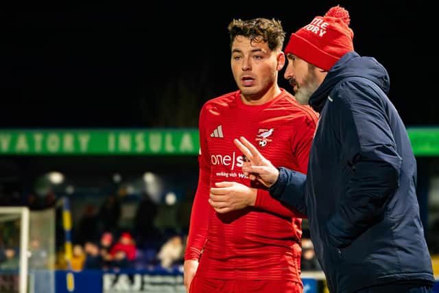 Boro boss Jono Greening passes on advice to two-goal hero Ste Walker in their excellent 4-1 win at NLN play-off rivals Radcliffe. Photo by Chris Marson