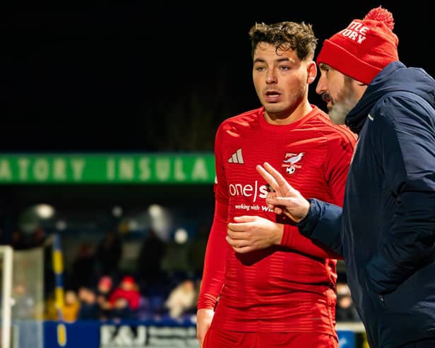 Boro boss Jono Greening passes on advice to two-goal hero Ste Walker in their excellent 4-1 win at NLN play-off rivals Radcliffe. Photo by Chris Marson
