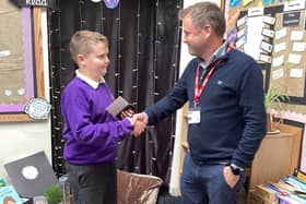 Alfie Weatherill of Hawsker-cum-Stainsacre School with Matt Gibson of Wharfedale Homes.