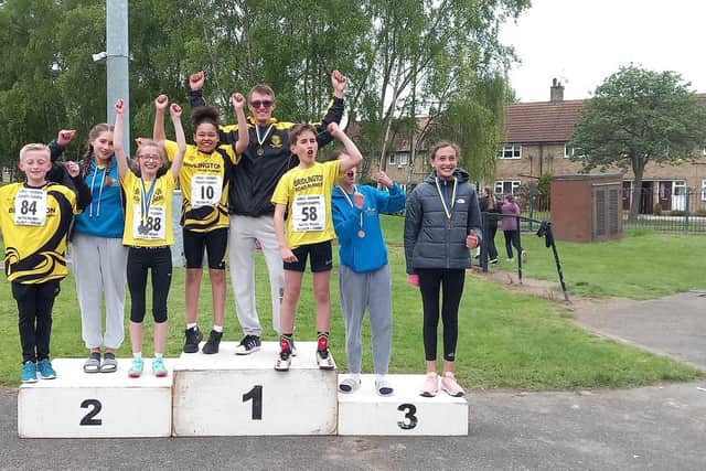 Bridlington Road Runners juniors celebrate their success at the Humberside Championships at the Costello Stadium.