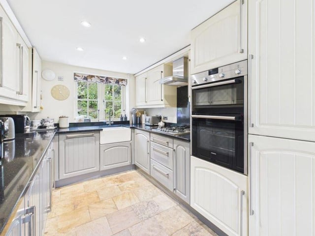 The well-equipped kitchen has integrated appliances.