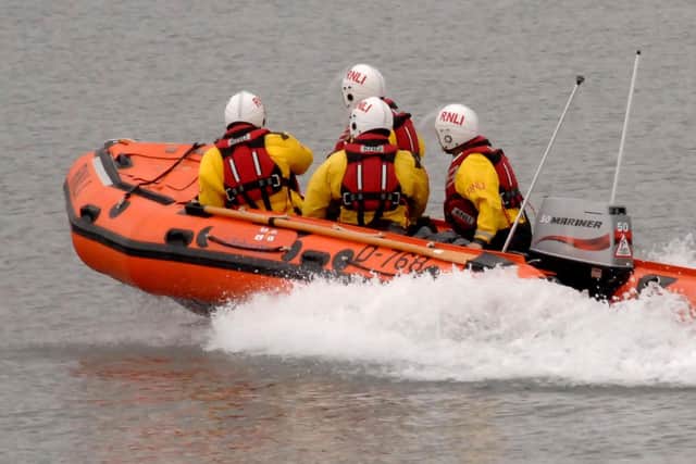Whitby RNLI rescue two people cut off by the tide.