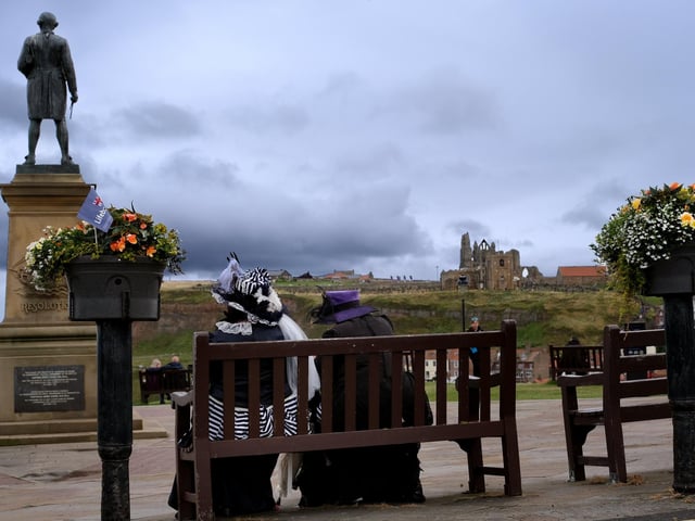 Visitors to Steampunk Weekend take a break by the Captain Cook statue.
picture: Richard Ponter