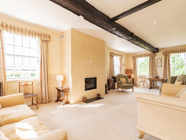 An extremely spacious drawing room of 30 feet, with natural light flooding in from three windows, has a recessed Italian firebox as a special feature.