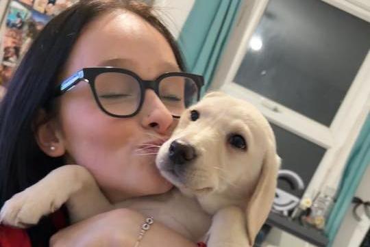 Sophia McDowell holding Hannah Elizabeth's gorgeous puppy!