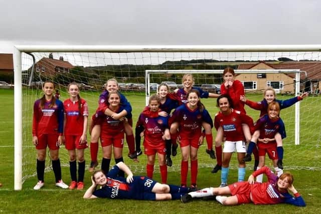 The Scarborough Ladies FC Under-12s team line up before their game at home to Huntington on Saturday morning.
